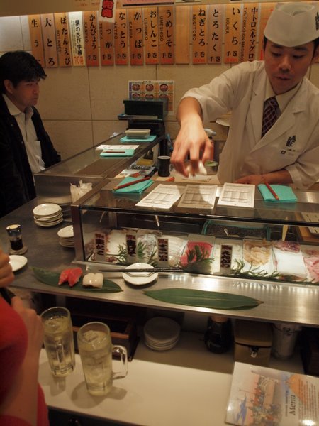 Eating Tokyo Stand Up Sushi in Shinjuku The Mad Traveler
